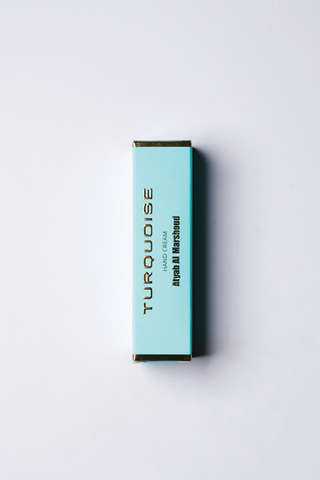 A Blue Color Box with Branding of TURQUOISE Hand Cream placed on a white background by Atyab Al Marshoud.